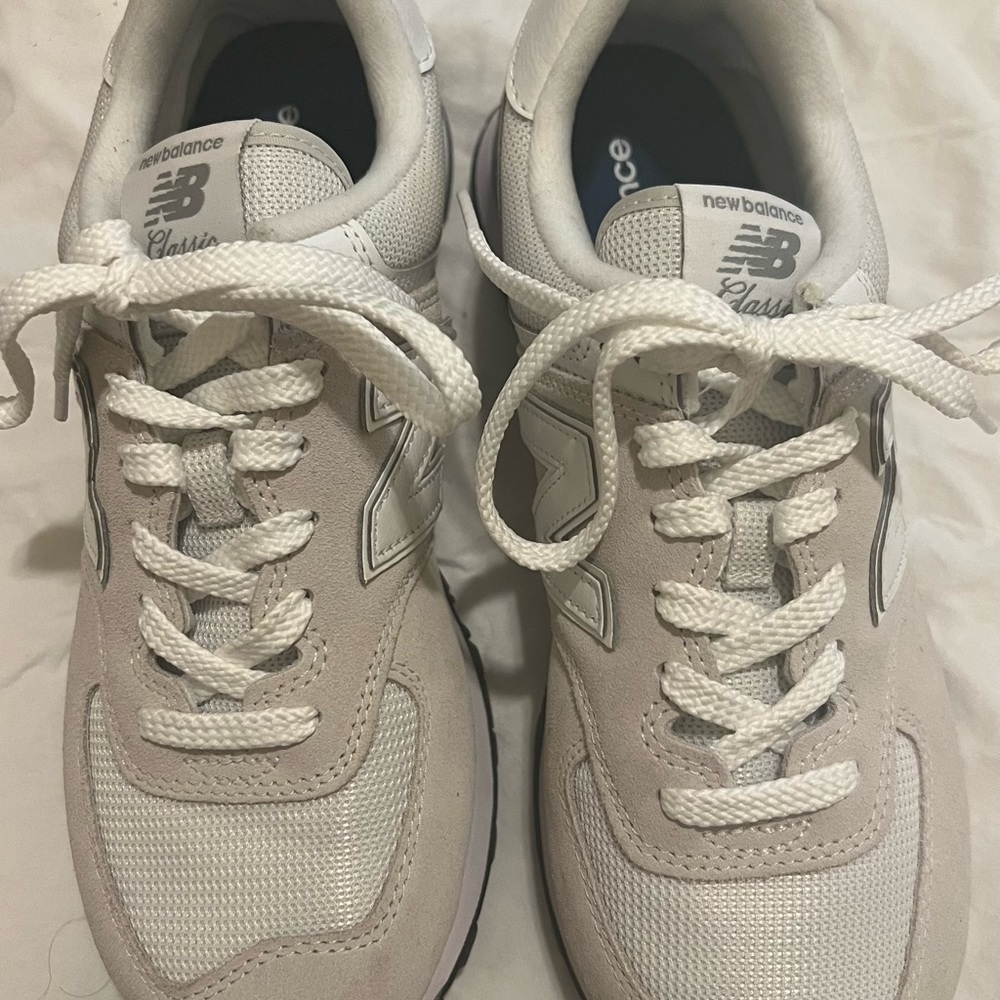 New Balance Women’s Classic 574 9.5 fits like a 9. Worn twice.